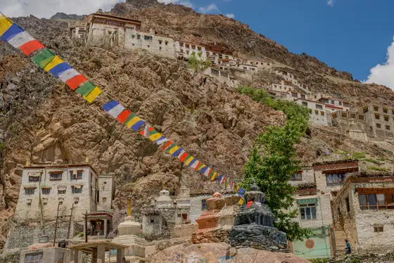 Prayer flags and mountain ridges at a high Ladakh pass