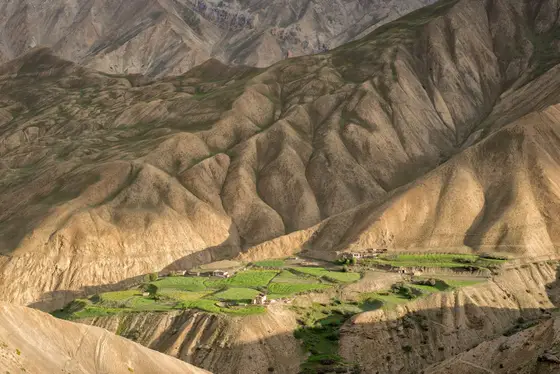 Wide valley overlook with river and white chortens in Ladakh
